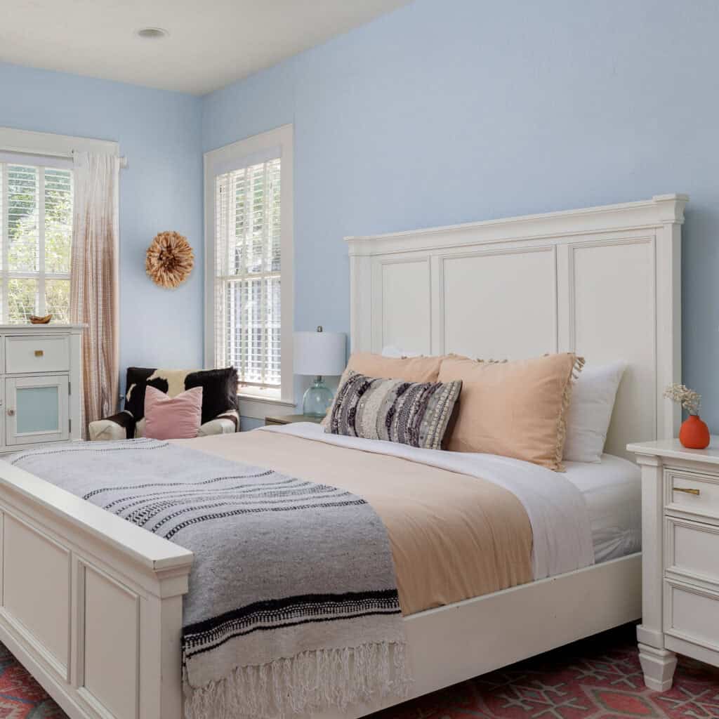 Home Bedroom at SoCo Cottage with a white bed and soft linens